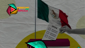 Una mano coloca una papeleta en una urna con la palabra "2024" escrita. El fondo presenta la bandera de México y el logo de "Derecho de Réplica" en la esquina superior izquierda. El logo tiene colores vivos y formas geométricas. El panorama general sugiere Elecciones 2024.